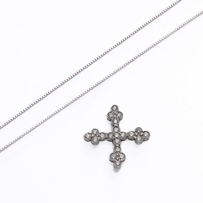 an image of a diamond cross pendant on a chain on a white background