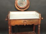 an old wooden table with a mirror on top of it