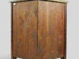 an old wooden cabinet with a marble top on a gray background