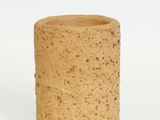 a wine cork that is sitting on a white surface