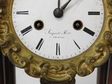 a clock with roman numerals on the face of it