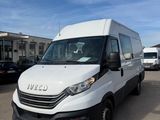 the white van is parked in a parking lot with other vehicles
