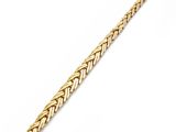 a yellow gold bracelet with a braid design on a white background