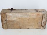 an old wooden box that is sitting on a table