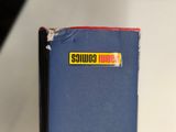 a blue book with a yellow sticker on it