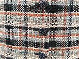 a close up of a skirt with buttons on it