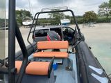 a boat that has two seats on the back of it