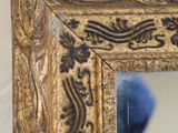 a picture of a mirror that is on the wall
