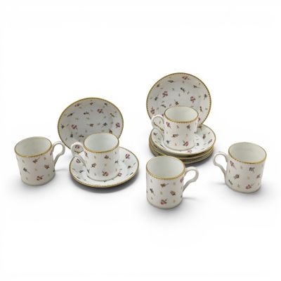 an image of a group of porcelain dishes and cups on a white surface