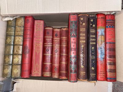 many old books in a box on the floor