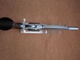 a picture of a gun that is laying on a table