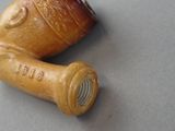 two pipe holders that are sitting on a table