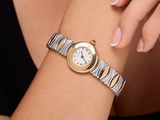 a woman that is wearing a watch on her wrist