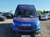 a blue van that is parked in a parking lot
