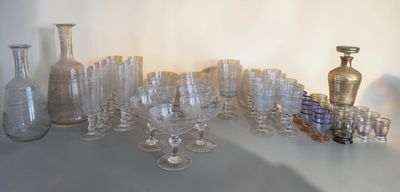a lot of glasses and vases on the table