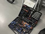 a bike that has tools in it on the floor