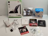 a lot of electronic items that are on the table