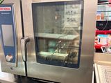 a silver oven sitting on top of a counter in a store