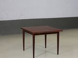 an image of a small table with a glass top in a room