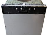 a dirty dishwasher sitting on top of a counter