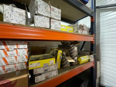 many boxes on the shelves in the warehouse