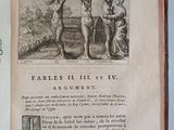 an open book with a picture of two naked women on it