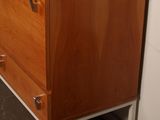 an image of a wooden dresser in a room