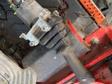 a close up of a car engine with wires attached to it