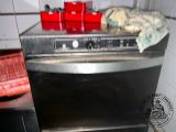 an oven with a lot of stuff on top of it