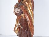 an image of a statue of a person holding a child