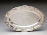 silver plate with scalloped edge and scalloped rim