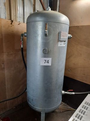 a water heater in the corner of a room