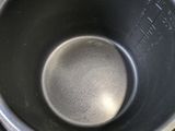 a metal pan with a metal lid on a table