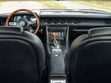 a car dashboard with a steering wheel and a dash board