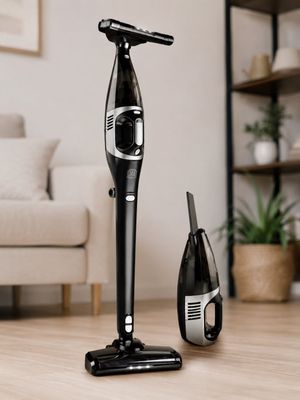 a black and silver vacuum on the floor next to a bottle of champagne