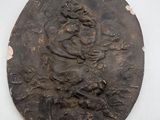 an image of a bronze plaque with a woman on it
