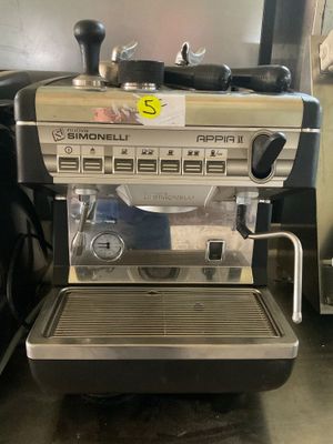 a coffee machine sitting on a counter in a kitchen
