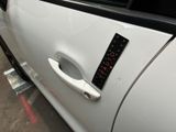 a sticker on the door handle of a car