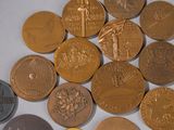 a lot of coins that are sitting on a table