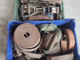 a blue box filled with a bunch of different types of belts