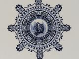 a blue and white plate with a rooster on it