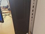 a desktop computer sitting on a desk next to a monitor
