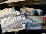 many old photos of old buildings on the table