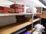 many rolls of paper on the shelves in the room