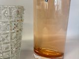 two glasses sitting next to each other on a table