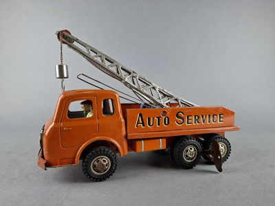 an orange toy truck with a crane on it