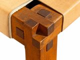 a close up of a wooden table with a drawer underneath it
