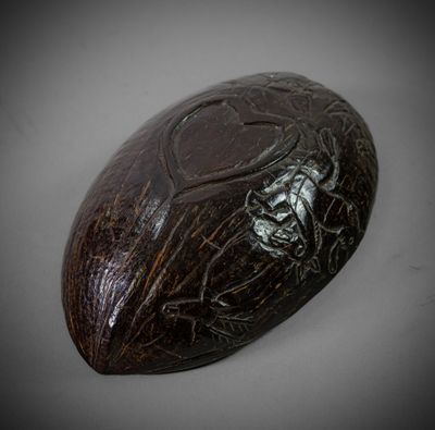 an image of a wooden object with a skull on it