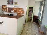 a kitchen with a counter and a refrigerator in it