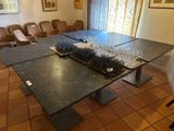 a table with a cake on it in the middle of a room